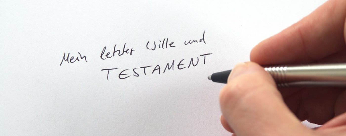 Hand writing Mein letzter Wille und Testament (German for My Last Will and Testament) in handwriting on white paper